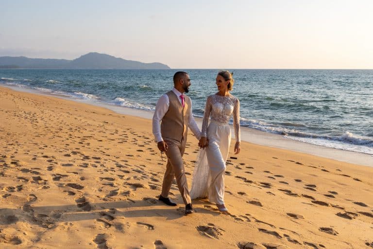 Tamar & Moe walking along the beach in Phuket